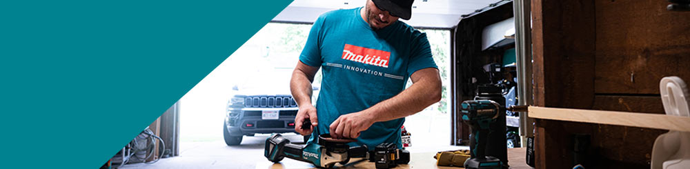 穿着Makita服装在车间工作的人的照片